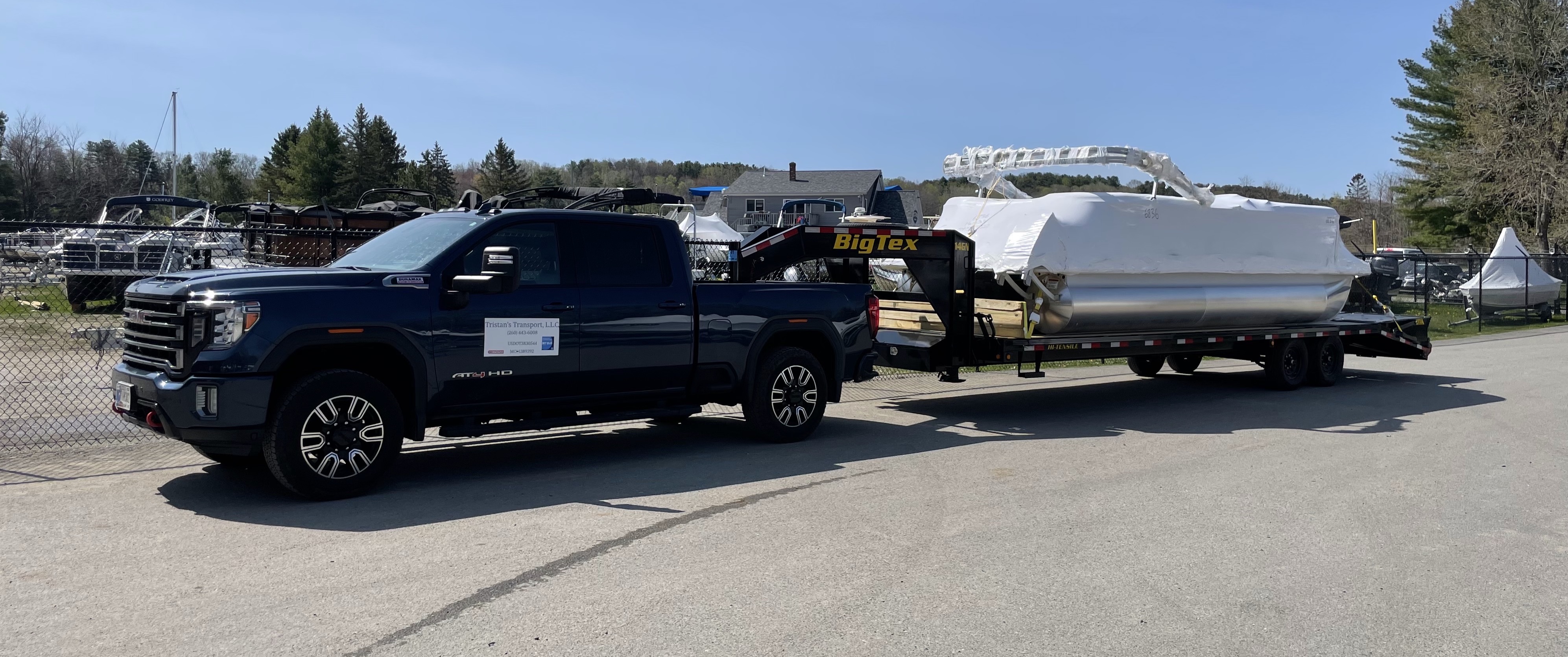 Pickup truck with boat on trailer